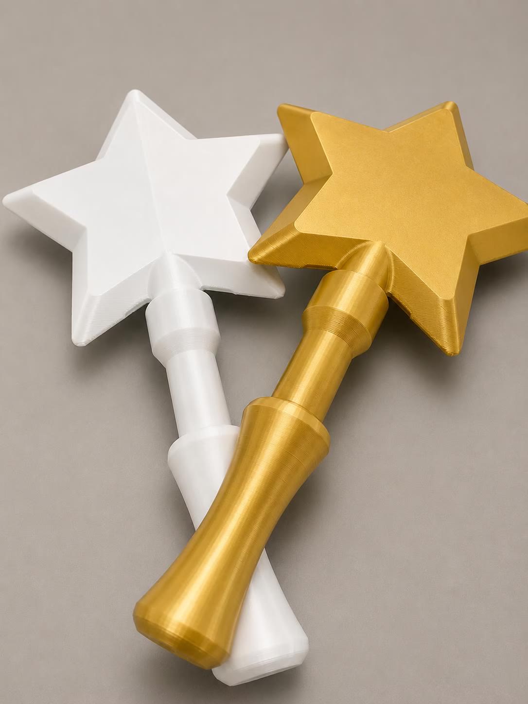 Tap-to-Pay Wand — a white star wand and a gold star wand, on a plain background.
